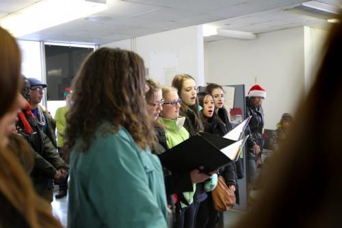 In the spirit of the season, students from the Kelvin High School choral program sing carols at  the  Child Guidance Clinic  700 Elgin Avenue Wednesday afternoon. This was just one of several stops the bus made to bring some Christmas cheer by carolling to staff in support for the Christmas Cheer Board.  Non-perishable food items, toys and cash were collected for the Cheer Board during the drive to help those in need during the holiday season. Standup photo   Dec 12, 2012, Ruth Bonneville  (Ruth Bonneville /  Winnipeg Free Press)In the spirit of the season, students from the Kelvin High School choral program jump from the steps of  the  Child Guidance Clinic  700 Elgin Avenue Wednesday afternoon and board a school bus after carolling to the staff and visitors at the centre.  This was just one of several stops the bus made in support for the Christmas Cheer Board.  Non-perishable food items, toys and cash were collected for the Cheer Board during the drive to help those in need during the holiday season. Standup photo   Dec 12, 2012, Ruth Bonneville  (Ruth Bonneville /  Winnipeg Free Press)