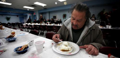 Lloyd Bone homes in on his cream pie, lingering between the second and third sittings at the Salvation Army Booth Center at Henry and Main Wednesday evening. 40 20lb turkeys, 300lbs of Mashed spuds, 15 gallons of gravy, 300 lbs of black forest ham, 300lbs of vegitables, 100 dozen dinner rols and 400 chocolate and cream pies were served in the four sittings between 430 and 730pm at the annual event. December12, 2012 - (Phil Hossack / Winnipeg Free Press)