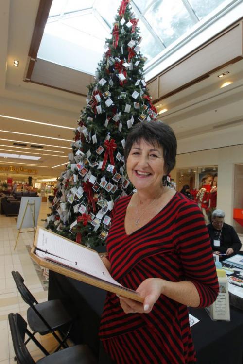 Pam Bolton volunteers for Hospice and Palliative Care Manitoba in many different roles. She will be helping out at the HPCM Memory Tree this Thurs Dec 13th at the St. Vital Mall from 9:30 am to noon. Here she poses for a photo in front of the tree. The Hospice Memory Tree is a special place to help ease the pain of grief during the holiday season and where you are invited to hang a card of remembrance for your loved one who has died. The tree offers a very meaningful and symbolic way to remember loved ones over the holiday season. This service to the community is provided at no cost to anyone wishing to honour the memory of their loved one. Specially trained volunteers from Hospice & Palliative Care Manitoba are on hand at the Tree to offer support and information on bereavement services. December 13, 2012  BORIS MINKEVICH / WINNIPEG FREE PRESS