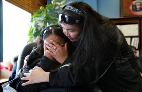 Corina Okemow (crying, left) is consoled by a friend of the family Celine Samuel after she breaks down into tears while hearing her younger brother's testimony (Ralph Okemow) during a press conference Thursday afternoon.  The press conference was held to bring attention to the death of their younger sister Tracy Okemow while she was in  RCMP custody on Nov 30th on God's Lake Reserve. See Alex Paul story. Dec 13, 2012, Ruth Bonneville  (Ruth Bonneville /  Winnipeg Free Press)