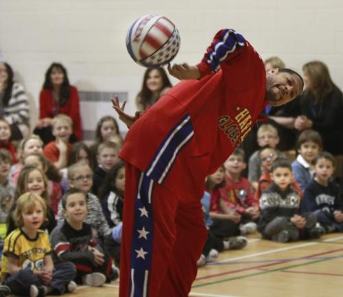 "Handles" Franklin, a member of the Harlem Globetrotters gets a basketball spinning during his presentation teaching children the ABCs of Bullying Prevention at Voyageur Elementary School Thursday. This is a community outreach program designed by the Harlem Globetrotters in coordination with the National Campaign to Stop Violence, the kids were taught how  Action, Bravery and Compassion can be used to reduce and stop bullying. The Globetrotters will playing a game at the  MTS Centre on Thursday, Jan. 5 at 2 p.m.  see release.   (WAYNE GLOWACKI/WINNIPEG FREE PRESS) Winnipeg Free Press  Dec.13   2012