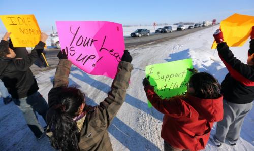 Members of Sandy Bay First Nation use a blockade on the Trans-Canada between Highway 16 and Road 42 West, to protest budget bill C45, Saturday, December 15, 2012. (TREVOR HAGAN/WINNIPEG FREE PRESS)
