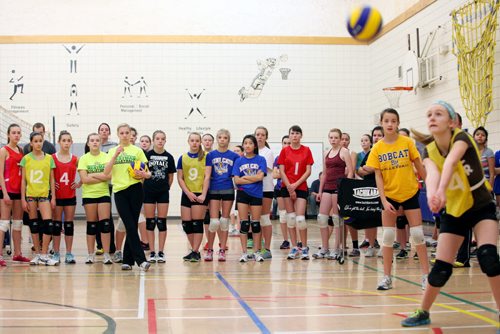 Brandon Sun 16122012 Some of the 85 grade 7 and 8 girls trying out for the U14 girls Storm club volleyball team watch as others take part in drills during tryouts at Kirkcaldy Heights School on Sunday. The Storm team will compete in the 2013 provincial club volleyball championships. (Tim Smith/Brandon Sun)