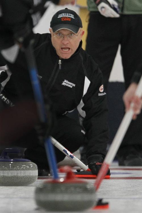 Randy Dutiaume curls in the provincial curling playdowns at Charleswood Curling Club Sunday, December 16, 2012. (John Woods/Winnipeg Free Press)