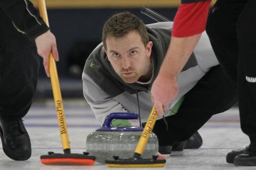 Justin Stanus curls in the provincial curling playdowns at Charleswood Curling Club Sunday, December 16, 2012. (John Woods/Winnipeg Free Press)