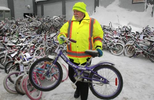 Bill Ward along with other supervisors at Emterra Environmental help load 100 refurbished children's bicycles on to trucks Monday morning that will be delivered to 11 organizations that will distribute them to kids throughout Winnipeg in time for Christmas.  The bikes were repaired  during the Winnipeg Repair Education and Cycling Hubs (The W.R.E.N.C.H.) Cycle of Giving,  their 2nd annual 24-hour Kids Bike Building Marathon last weekend.     see release sent   (WAYNE GLOWACKI/WINNIPEG FREE PRESS) Winnipeg Free Press  Dec.17   2012