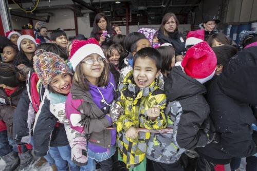 Around 150 kids from three Winnipeg School Division elementary schools, Strathcona, Mulvey and Dufferin, got to have lunch in the Winnipeg James Armstrong Richardson International Aiport's firehall where Santa just happened to be testing out the STARS helicopter. Fred Penner was on hand to perform some music too. 121217 - Monday, December 17, 2012 -  (MIKE DEAL / WINNIPEG FREE PRESS)