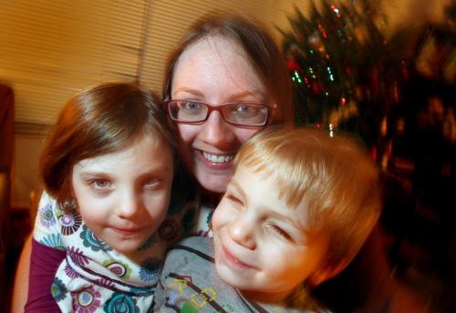 Christine McIntyre happily holds her kids Isla (left) and Colin (right) The trio have created a facebook page called 27 Acts for Newtown. See Nick Martin's tale. December 17, 2012 - (Phil Hossack / Winnipeg Free Press)