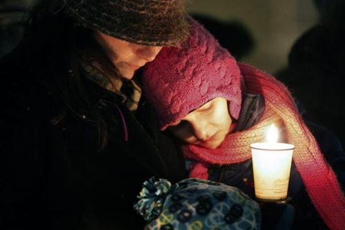 December 17, 2012 - 121217  -  On Monday December 17, 2012 at the University of Winnipeg a woman comforts children at a vigil for six year old Ana Grace Marguez-Greene who was killed in Newtown, CT Friday, December 14. Ana mother taught at the University of Winnipeg and her father taught at the University of Manitoba before moving to Newtown this past July John Woods / Winnipeg Free Press