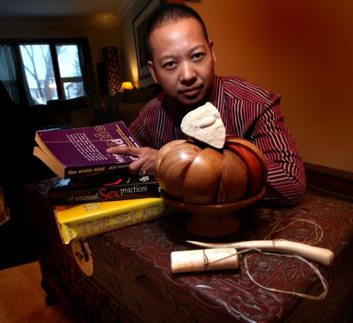 MY STUFF, Reece Malone a local Sexologist, poses with some of his stuff, rare Sexology Books, a arved trunck, Wood serving Bowl Fossilized egg?, Inuit stick and Ball game, Iyaga. See Carolin Vesely's story December 19th, 2012 - (Phil Hossack / Winnipeg Free Press)