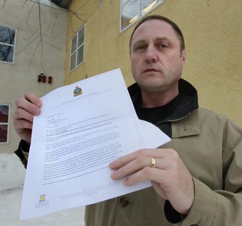 Todd Dube holds correspondence from the city police informing him he'll have to pay about $500,000 and wait about 8 years to get his FIPPA request fulfilled. He wants all documents/emails/correspondence which mention his and WiseUp Winnipeg's name to see what they're saying about him.Bruce Owen story    (WAYNE GLOWACKI/WINNIPEG FREE PRESS) Winnipeg Free Press  Dec.20   2012