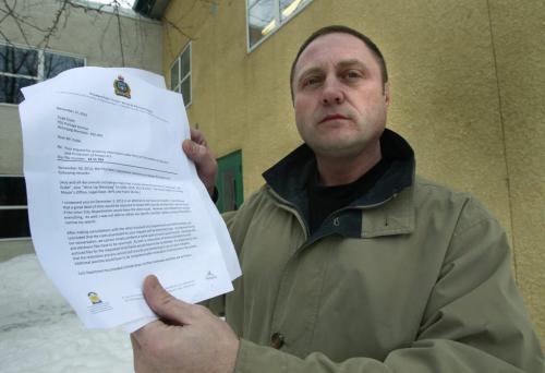 Todd Dube holds correspondence from the city police informing him that he'll have to pay about $500,000 and wait about 8 years to get his FIPPA request fulfilled. He wants all documents/emails/correspondence which mention his and WiseUp Winnipeg's name to see what they're saying about him.Bruce Owen story    (WAYNE GLOWACKI/WINNIPEG FREE PRESS) Winnipeg Free Press  Dec.20   2012