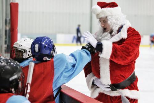 Ten minutes for being a smart-aleck!  Instructor Andrew Rhoden is revealed as Santa's Helper after his beard is pulled by a grade 5 kid from Stevenson Britannia school who is taking part in the Winnipeg Jets Hockey Academy program at the MTS IcePlex Thursday afternoon. 121220 December 20, 2012 Mike Deal / Winnipeg Free Press