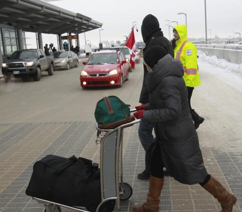 Protesters drove slowly in a circuit around the James Armstrong Richardson International Airport terminal between 9 a.m. and 11 a.m. Friday morning to raise awareness of issues facing First Nations communities. This action is not part of the official Idle No More movement but is being held in a show of support for it.(WAYNE GLOWACKI/WINNIPEG FREE PRESS) Winnipeg Free Press  Dec.21   2012