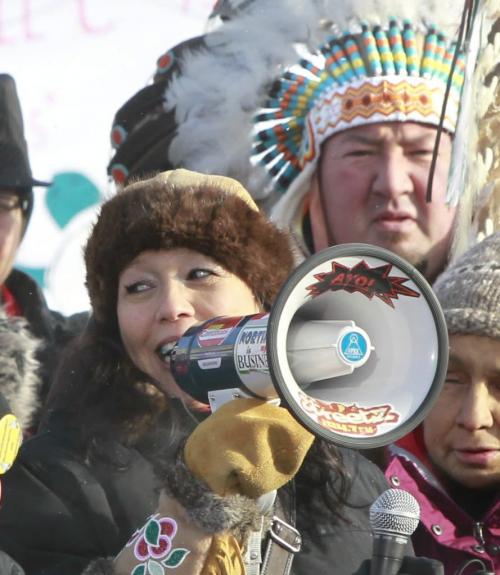 Tina Keeper with megaphone and Grand Chief Derek Nepinak spoke to the apromatley 300 people attending a Idle No More rally in the Oodena Celebration Circle at The Forks Friday in solidarity with an Idle No More rally at Parliament Hill in Ottawa.   (WAYNE GLOWACKI/WINNIPEG FREE PRESS) Winnipeg Free Press  Dec.21   2012