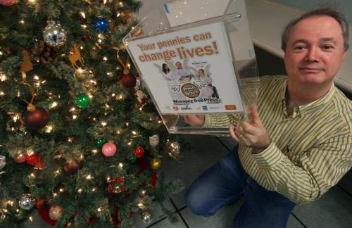 Winnipeg Free Press Pennies from Heaven campaign chair Kevin Rollason with empty collection container-Recent estimates show pennies campaign down 50% from previous years - See Kevin Rollason story - December 21, 2012   (JOE BRYKSA / WINNIPEG FREE PRESS)