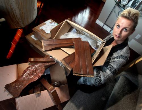 Monica Huisman shows off the several boxes containing "bits" of an heirloom antique chair she had shipped "intact" from Europe. It arrived smashed into bits in several boxes.....See Sara Petz story.....December 21, 2012 - (Phil Hossack - Winnipeg Free Press)