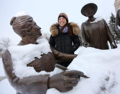 Winnipeg Free Press reporter, Gabrielle Giroday, at the Nellie McClung statue on the west side of the Manitoba Legislative Grounds, Saturday, December 22, 2012. (TREVOR HAGAN/WINNIPEG FREE PRESS) - our winnipeg sunday xtra