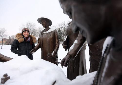 Winnipeg Free Press reporter, Gabrielle Giroday, at the Nellie McClung statue on the west side of the Manitoba Legislative Grounds, Saturday, December 22, 2012. (TREVOR HAGAN/WINNIPEG FREE PRESS) - our winnipeg sunday xtra
