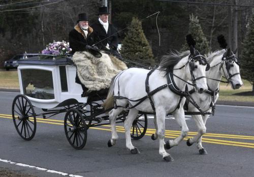 Bloomfield, CT - 10/22/12 - A horse-drawn carriage on E. Wintonbury Avenue, carries Ana Grace Marquez-Greene's casket to The First Cathedral in Bloomfield Saturday for the wake and service to follow.  Brad Horrigan / Hartford Courant