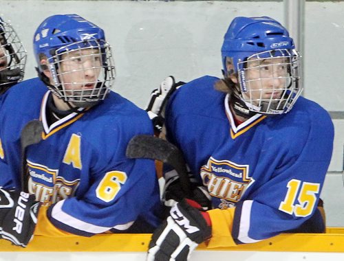 Brandon Sun 22122012 Twin Brothers Bradley and Shawn Bowles of the Yellowhead Chiefs watch the action between shifts during Midget AAA Hockey action against the Brandon Wheat Kings at the Sportsplex on Saturday evening. (Tim Smith/Brandon Sun)