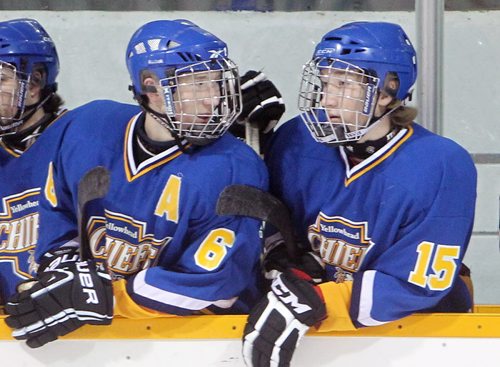 Brandon Sun 22122012 Twin Brothers Bradley and Shawn Bowles of the Yellowhead Chiefs chat on the bench between shifts during Midget AAA Hockey action against the Brandon Wheat Kings at the Sportsplex on Saturday evening. (Tim Smith/Brandon Sun)