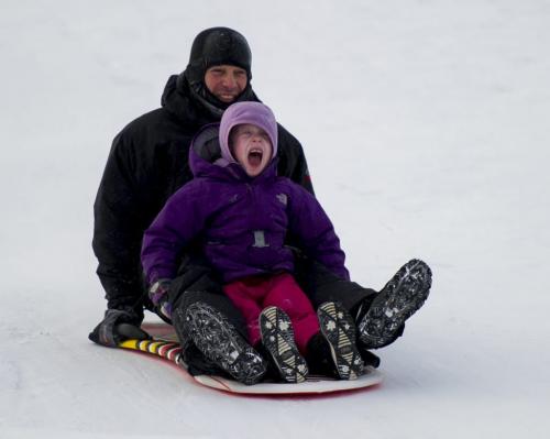122312 Winnipeg - Maya Shore (age 6) lets out a sream with dad Sean, as they go down the hill at Westview Park Sunday morning. DAVID LIPNOWSKI / WINNIPEG FREE PRESS