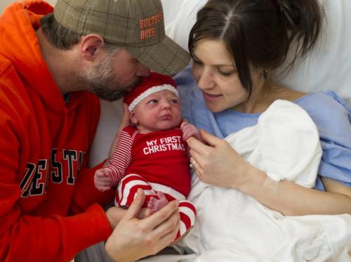 122512 Winnipeg -  A little Champagne for Christmas - Christmas Baby - Stephanie Champagne and John Bults hold their 6 hour old daughter Cadence Bults Tuesday morning. Cadence was born at 4:18AM on Christmas day at St. Boniface Hospital, weighing 8 pounds, 1 ounce. DAVID LIPNOWSKI / WINNIPEG FREE PRESS