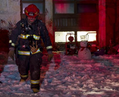 122512 Winnipeg -  Firefighters put out a house fire on Mapleridge Ave. Tuesday evening of Christmas day. DAVID LIPNOWSKI / WINNIPEG FREE PRESS