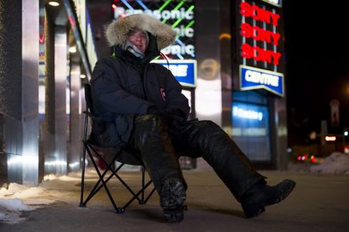 122512 Winnipeg -  Glen has been waiting since 7pm at Advance Electronics Tuesday evening of Christmas day to buy a 50" flatscreen TV for a friend who is unable to wait in line due to a surgery. Glen expects to save $500. DAVID LIPNOWSKI / WINNIPEG FREE PRESS
