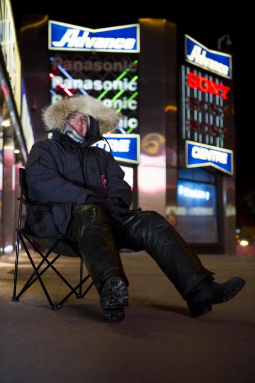 122512 Winnipeg -  Glen has been waiting since 7pm at Advance Electronics Tuesday evening of Christmas day to buy a 50" flatscreen TV for a friend who is unable to wait in line due to a surgery. Glen expects to save $500. DAVID LIPNOWSKI / WINNIPEG FREE PRESS