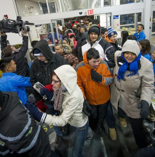 122612 Winnipeg -  The first customers rush through the door for Boxing Day deals at 6AM at the St. James Best Buy.  DAVID LIPNOWSKI / WINNIPEG FREE PRESS