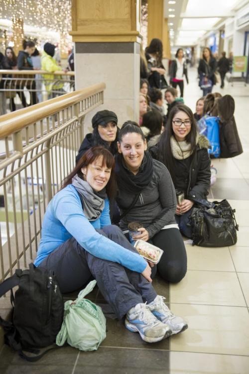 122612 Winnipeg -  Tiffaney Taverner (left) was first in line, with friend Kerris Chinery, were in front of hundreds of people (mostly women) who waited in line for the 8AM opening of the Polo Park Lululemon  store on Boxing Day.  DAVID LIPNOWSKI / WINNIPEG FREE PRESS