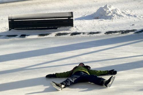 122612 Winnipeg - A boy falls while ice skating at The Forks Wednesday on Boxing Day.  DAVID LIPNOWSKI / WINNIPEG FREE PRESS