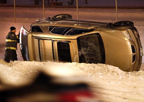 One person was checked out by Fire Paramedics after a vehicle rolled into the ditch travelling north on Lagimodiere Blvd. near Maginot St. Friday morning.  . (WAYNE GLOWACKI/WINNIPEG FREE PRESS) Winnipeg Free Press  Dec.28   2012