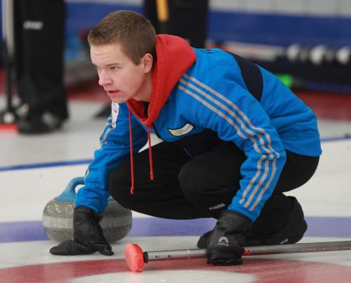 Cole Peters from West St Paul Curling Club competes against Matt Dunstone in the  Tim Hortons Christmas Youth Bonspiel at Deer Lodge Curling Club Friday night- See Ed Tait story- December 27, 2012   (JOE BRYKSA / WINNIPEG FREE PRESS)