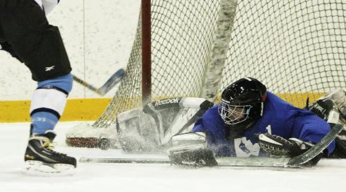 Christian Clavelle makes an acrobatic save during a weekly game of hockey at the Winnipeg Winter Club, Saturday, December 29, 2012. (TREVOR HAGAN/ WINNIPEG FREE PRESS)