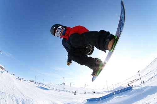 Colin Jakilazek, 21, does a grab while jumping over a tabletop while snowboarding at Spring Hill, Saturday, December 29, 2012. (TREVOR HAGAN/ WINNIPEG FREE PRESS)