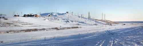 Skiers and snowboarders dot the hill at Springhill, located in the floodway, Saturday, December 29, 2012. (TREVOR HAGAN/WINNIPEG FREE PRESS) - 3 image panorama