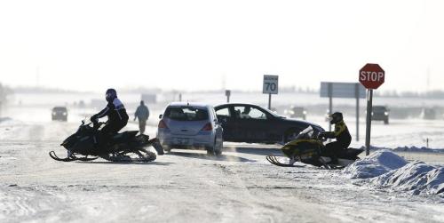 Snowmobilers pull into the 59er on Highway 59, Saturday, December 29, 2012. (TREVOR HAGAN/WINNIPEG FREE PRESS)