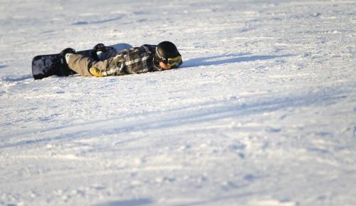 A young snowboarder sits face down at Springhill, Saturday, December 29, 2012. (TREVOR HAGAN/WINNIPEG FREE PRESS)