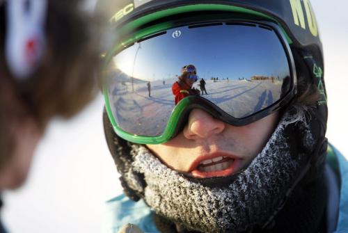 Hunter Schur, 15, a snowboarder, chatting with his friend, Joseph Kelly, 18, seen in reflection, at Springhill, Saturday, December 29, 2012. (TREVOR HAGAN/WINNIPEG FREE PRESS)