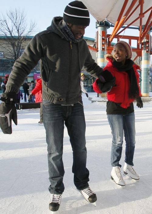 December 29, 2012 - 121229 - Jules Douglas and Sine Ngwabije skate at the Forks Saturday December 29, 2012. They talked about their resolutions. John Woods / Winnipeg Free Press