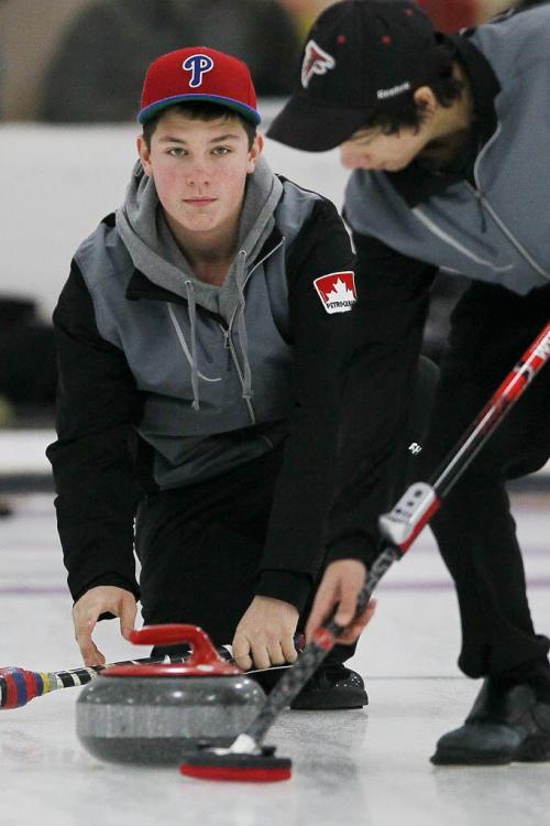 December 29, 2012 - 121229 - Colin Kurz curls against Matt Dunstone in the junior men's women's curling final at Assinboine Curling Club Saturday December 29, 2012. John Woods / Winnipeg Free Press