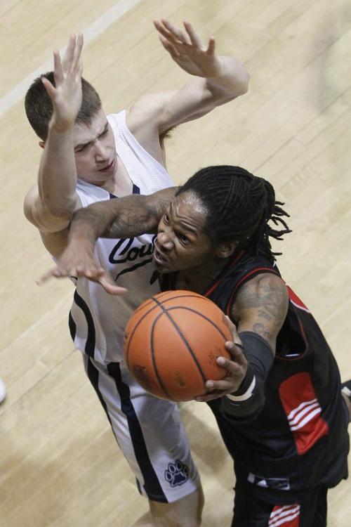 December 29, 2012 - 121229 - University of Winnipeg Wesmen Steven Wesley (8) attempts to drive past Mount Royal University Cougars Ray Goff (2) as he drives for the basket in the high school semi-final of the Wesmen Classic at the University of Winnipeg Saturday December 29, 2012.  John Woods / Winnipeg Free Press