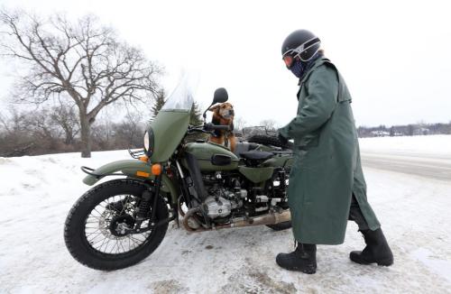Rowan Horrick and his dog, Doog, on an Ural motorcycle during a ride through Assiniboine Park, Sunday, December 30, 2012. (TREVOR HAGAN/WINNIPEG FREE PRESS)