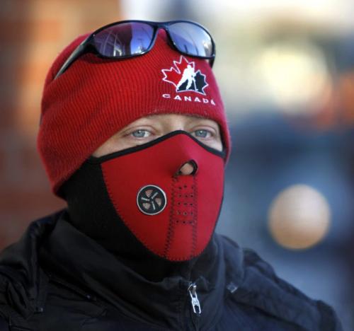 Scott Yaworsky was dressed for the -22C Monday morning temperature and was warmed up by Team Canada's win over  Russia 4-1 Monday to lock up a semifinal berth at the world junior hockey championship. (WAYNE GLOWACKI/WINNIPEG FREE PRESS) Winnipeg Free Press  Dec.31   2012