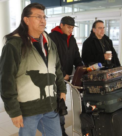 From left, Cross Lake First Nation elder Raymond Robinson and son Baptiste 21 and Chief Garrison Settee at the James A. Richardson International Airport to catch a flight to Ottawa Monday for Robinson to join Chief Spence of Attawapiskat in her hunger strike. Robinson has been on hunger strike with her since Dec 12.¤ ¤ ¤(WAYNE GLOWACKI/WINNIPEG Free Press) Dec. 31 2012