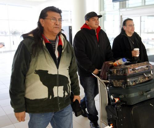 From left, Cross Lake First Nation elder Raymond Robinson and son Baptiste 21 and Chief Garrison Settee at the James A. Richardson International Airport to catch a flight to Ottawa Monday for Robinson to join Chief Spence of Attawapiskat in her hunger strike. Robinson has been on hunger strike with her since Dec 12.¤ ¤ ¤(WAYNE GLOWACKI/WINNIPEG Free Press) Dec. 31 2012