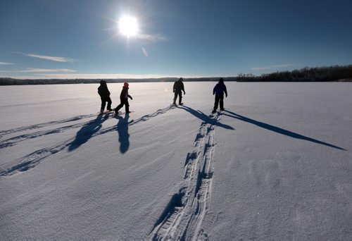 Brandon Sun Members of the 23rd Brandon Scouting Group blaze a trail across the snow-covered Williams Lake during a family fun day trip to Turtle Mountain Provincial Park on Saturday, Dec. 29, 2012. (Bruce Bumstead/Brandon Sun)